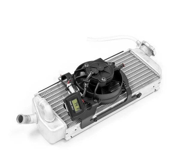 A Trail Tech water cooler with a silver aluminum radiator core, black cooling fan, and digital temperature gauge, shown on a white background with the Trail Tech logo in the bottom right corner.
